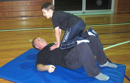 Child and dad exercising at a HDHK session